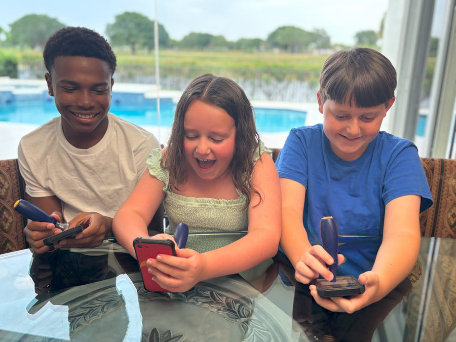 Children enjoying mobile gaming together